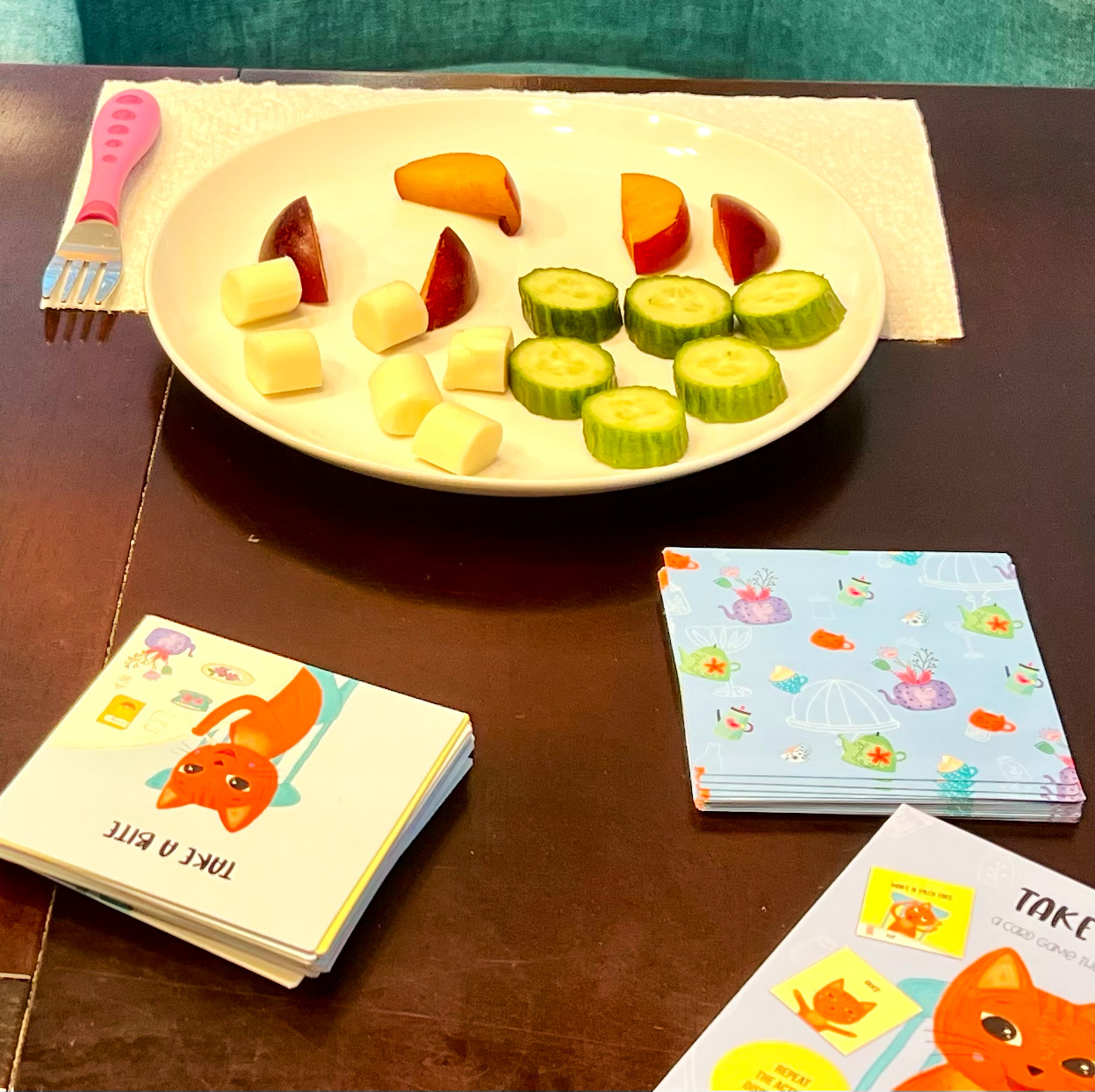 a plate of food and a deck of cards